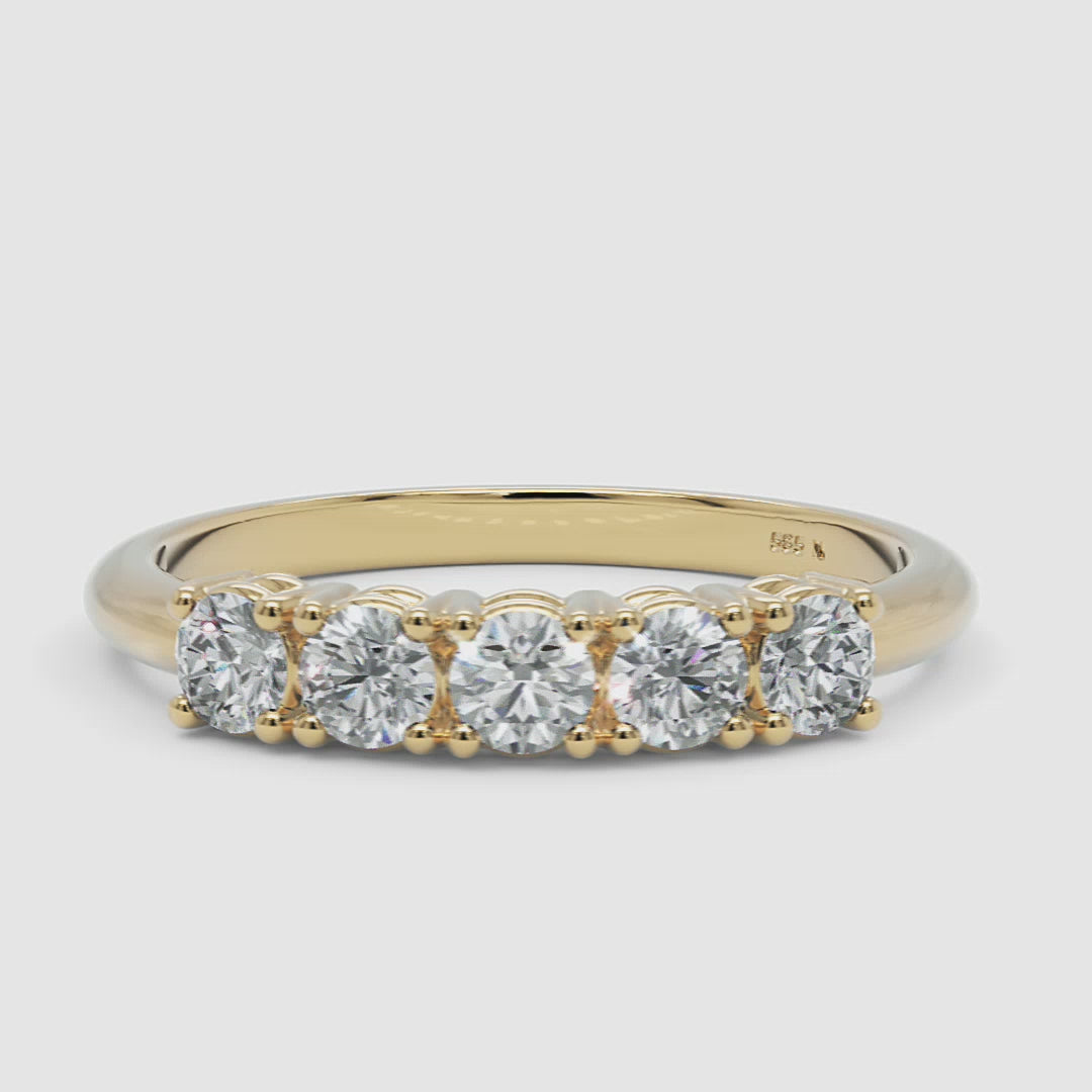360-degree video of the yellow gold five-stone diamond ring, smoothly rotating to reveal the prong-set diamonds and polished gold band
