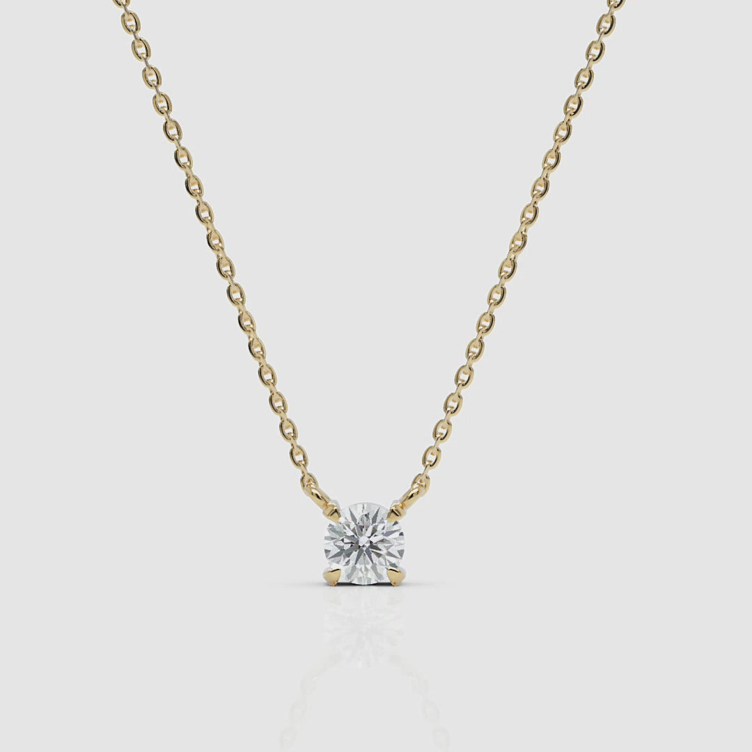 front view of 14k gold diamond solitaire necklace with brilliant round cut, white background, cropped from a 360-degree product video
