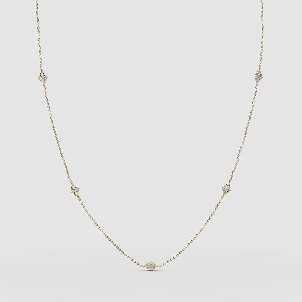 Product VIDEO of the diamond station necklace in yellow gold, displayed in a gentle arc to highlight each bezel-set stone.