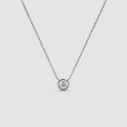 360-degree view of a white gold diamond necklace with a bezel setting, rotating to show the full chain and pendant from all angles.
