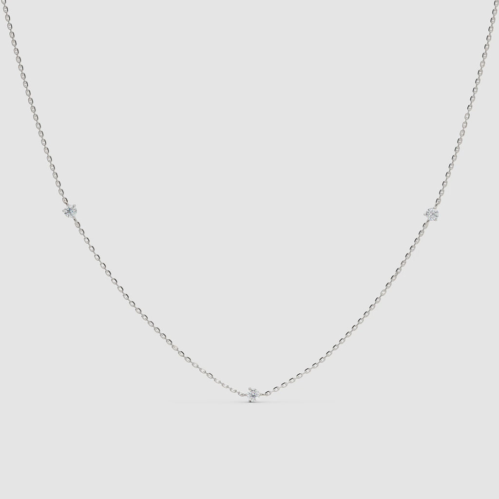 360-degree video of a 14k white gold necklace featuring spaced round diamonds on a delicate chain, rotating to show full detail and sparkle
