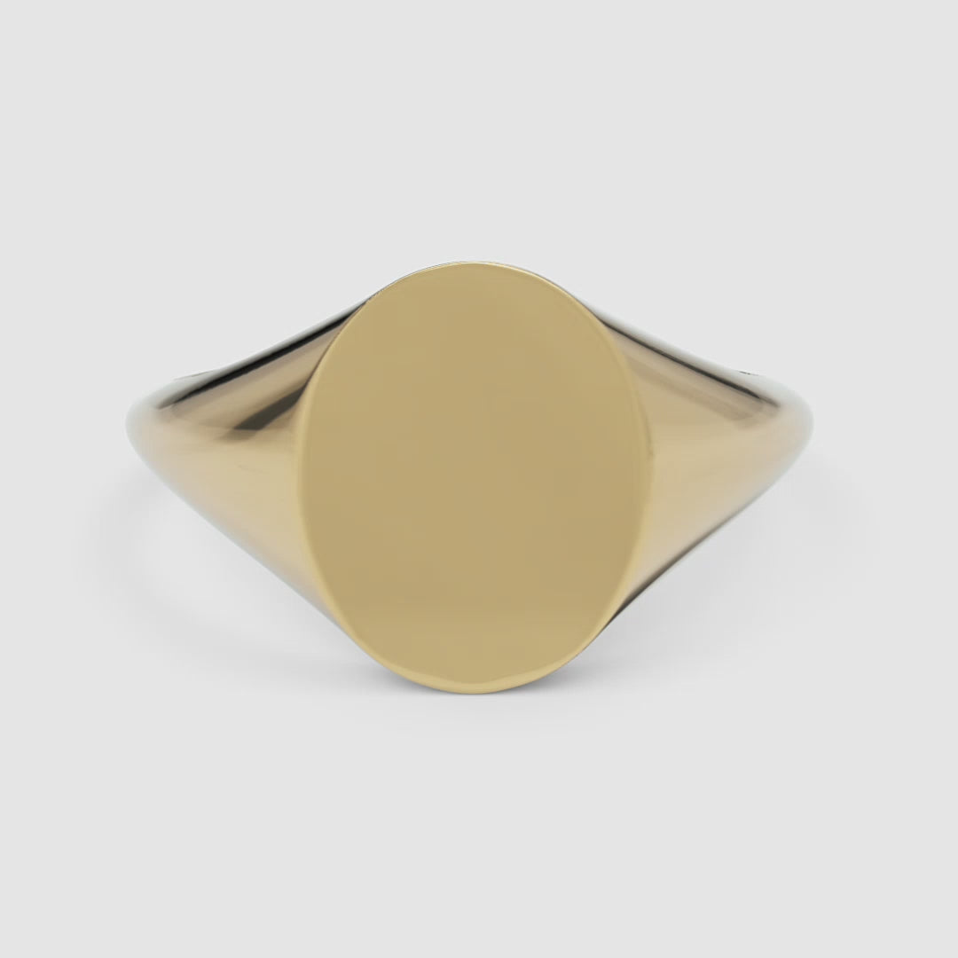 360-degree video of the yellow gold oval signet ring, smoothly rotating to reveal its curved silhouette and mirror-like shine from all angles
