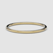 A 360-degree video of a 14k yellow gold thin band, smoothly rotating to reveal its polished, delicate design from every angle.