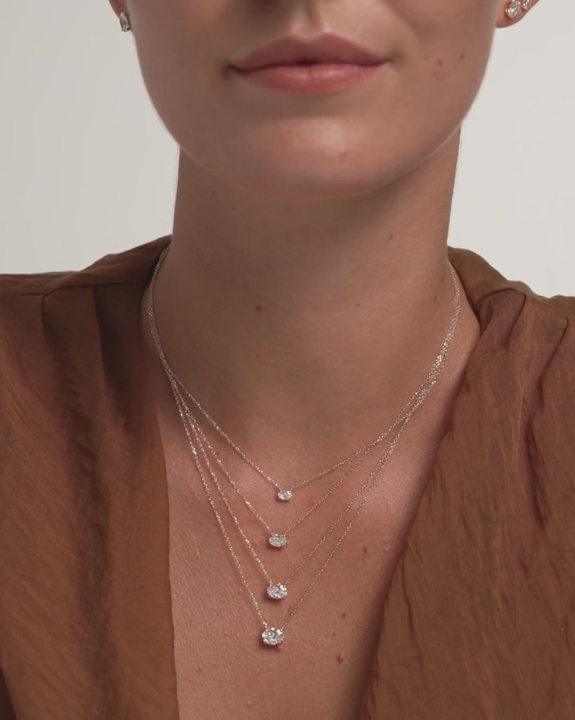 Oval diamond necklaces in four sizes worn on the model, ENEA Studio