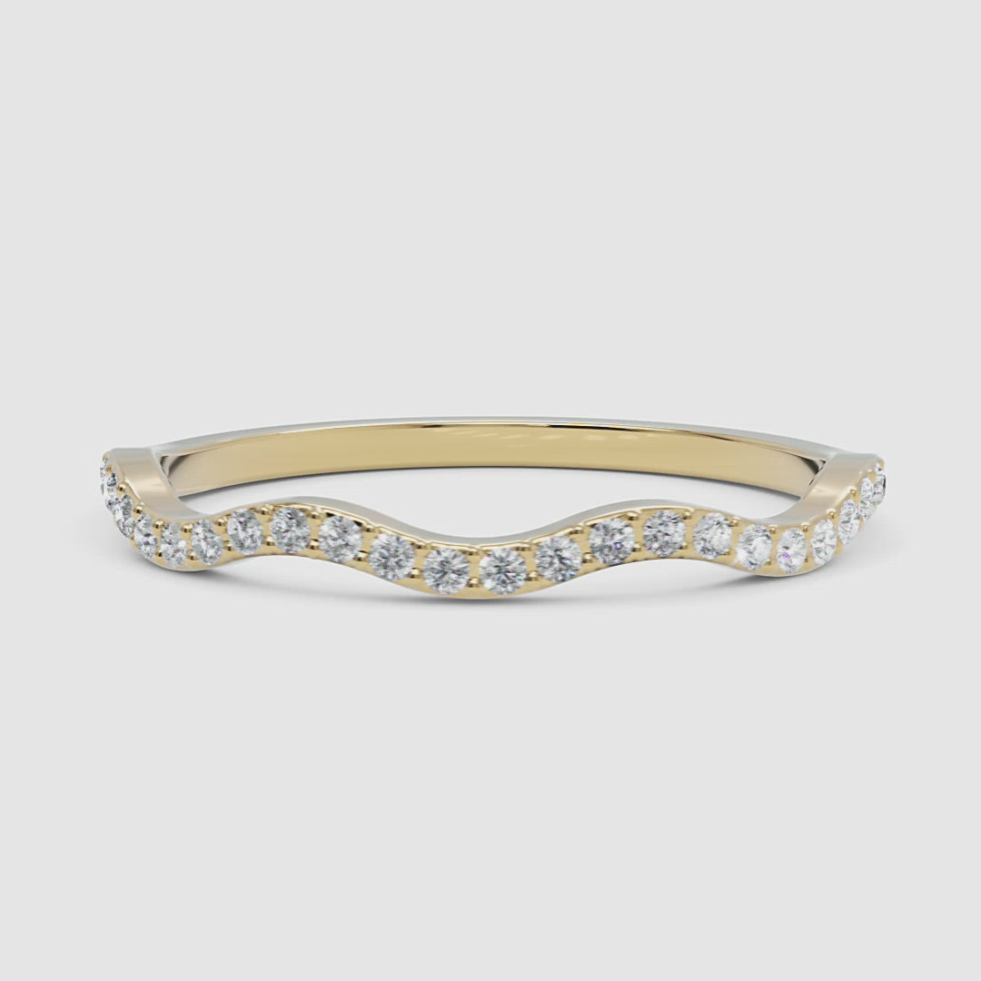 A rotating 360-degree video of a yellow gold wave diamond ring, displaying its brilliance from every angle.