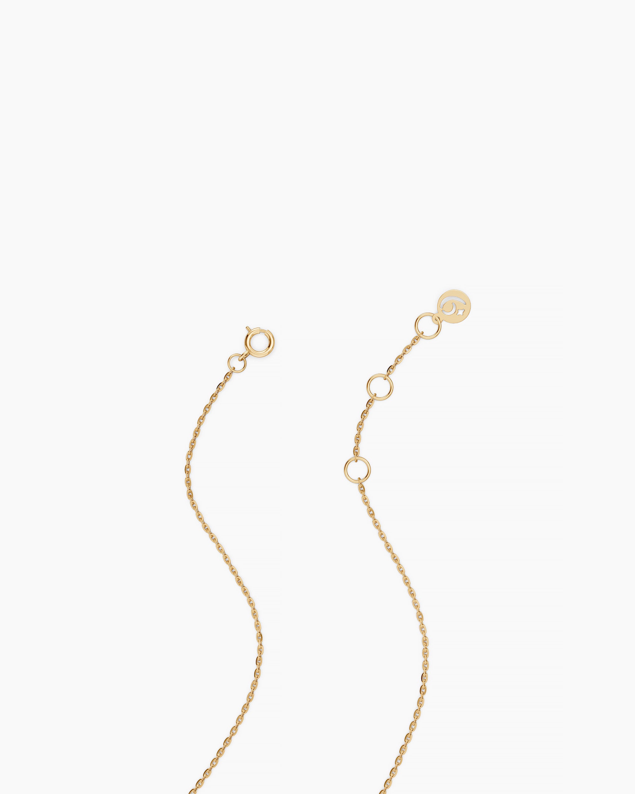 Close view of the solid yellow gold extender chain and clasp