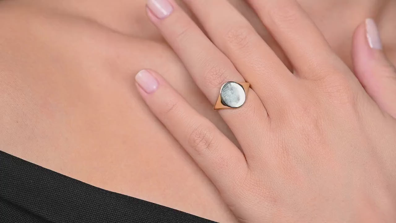 Video of a model wearing the yellow gold oval signet ring, naturally moving her hand to highlight the ring’s bold yet elegant design and high-polish finish
